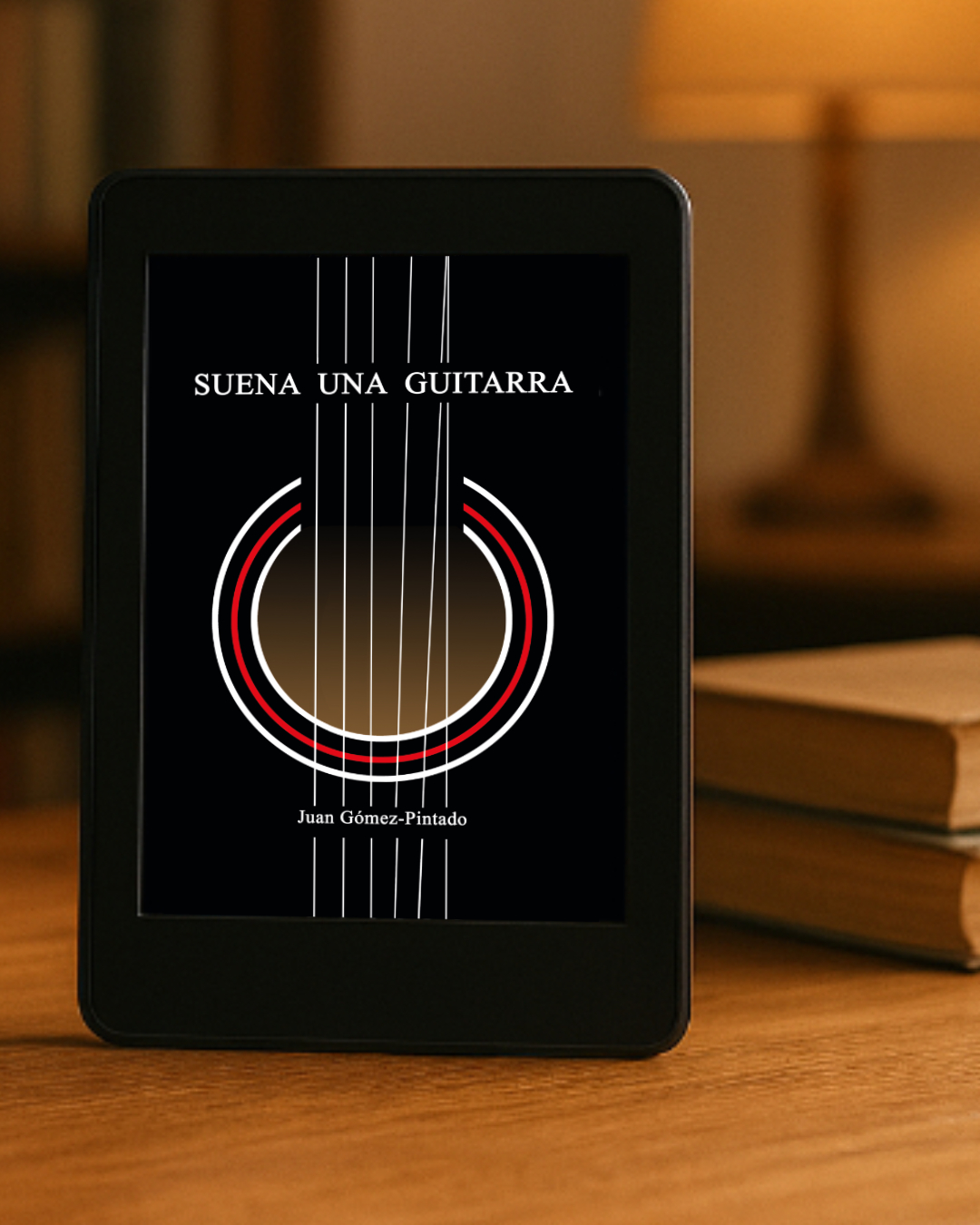 Kindle con la portada de Suena una guitarra, de Juan Gómez-Pintado